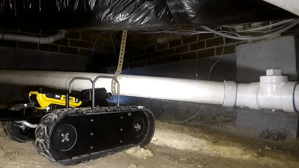 Remote inspection robot navigating a crawl space in Boston.