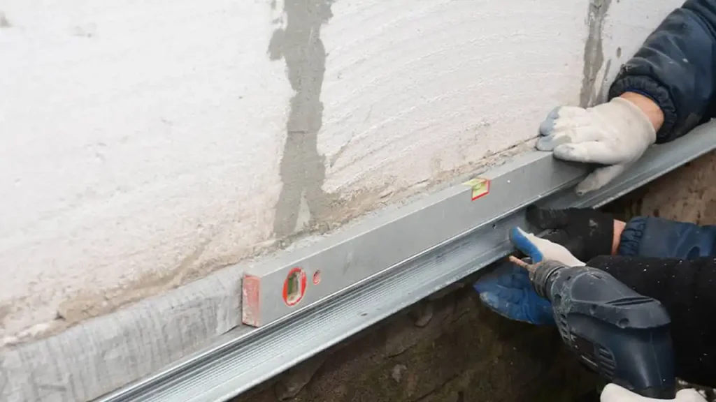 Checking the level of a newly repaired concrete surface in Boston.